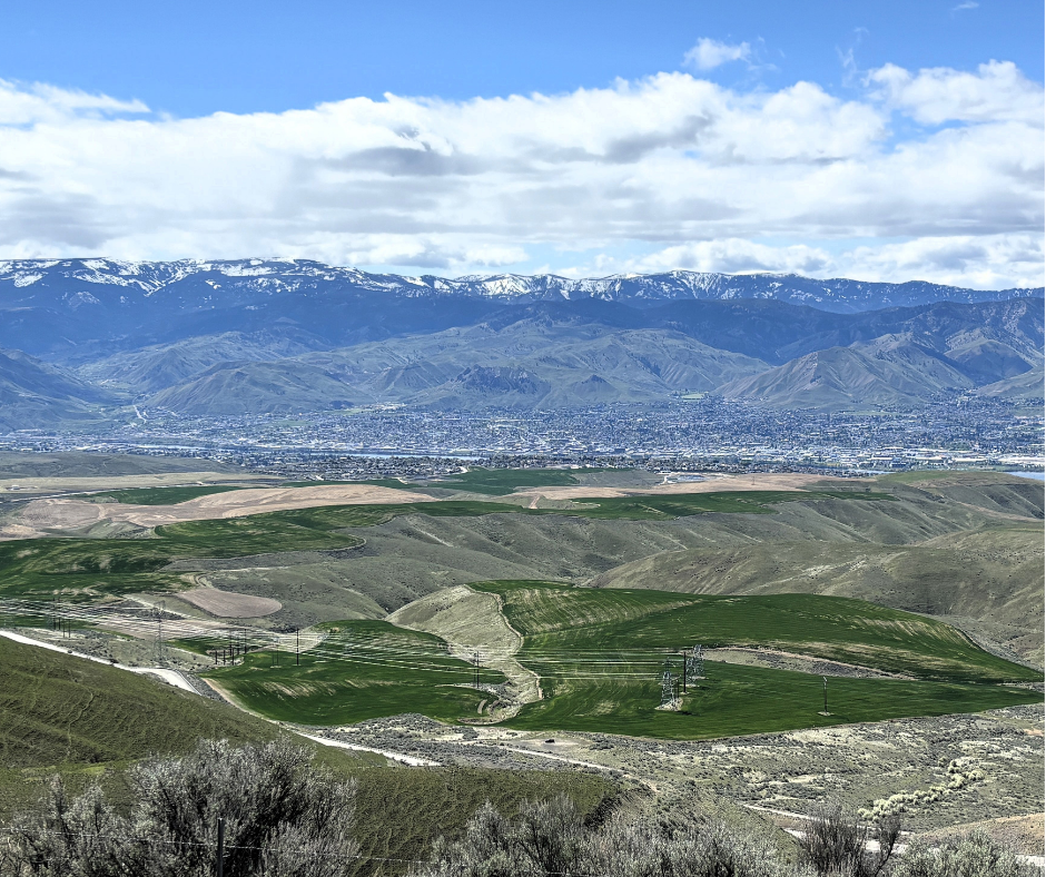 Mountains, hillside, and sky